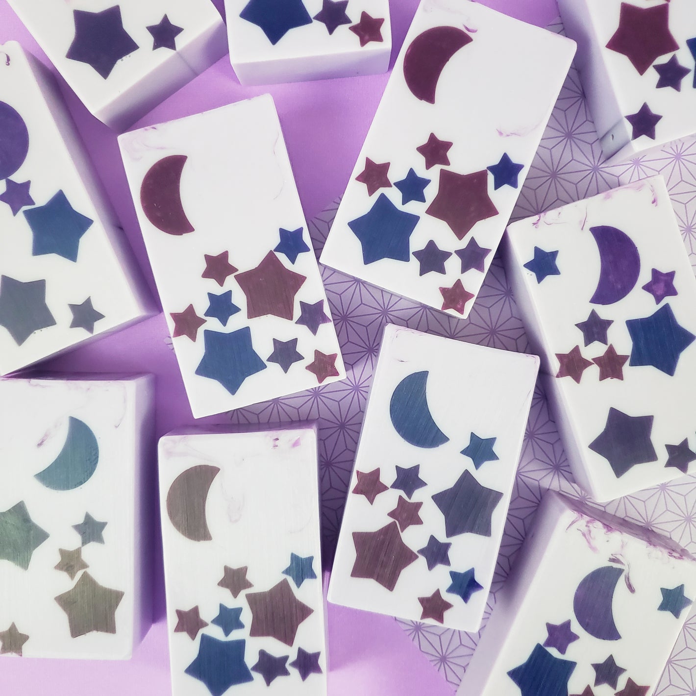 purple bars of soap with a darker purple stars and moons design