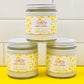 3 jars of Hello Sunshine lotion on a yellow and white background