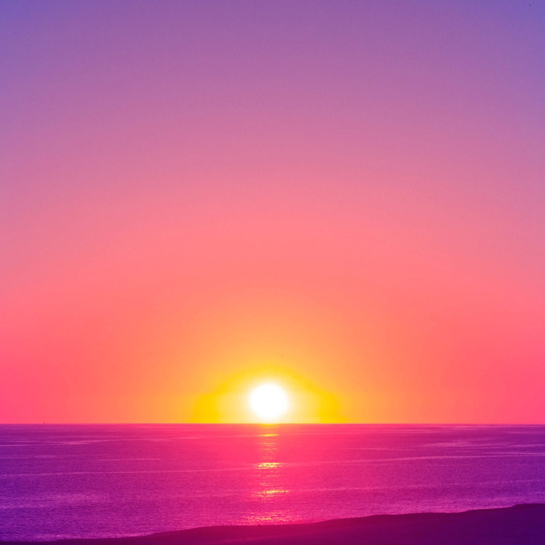 A pink and purple sunset over water