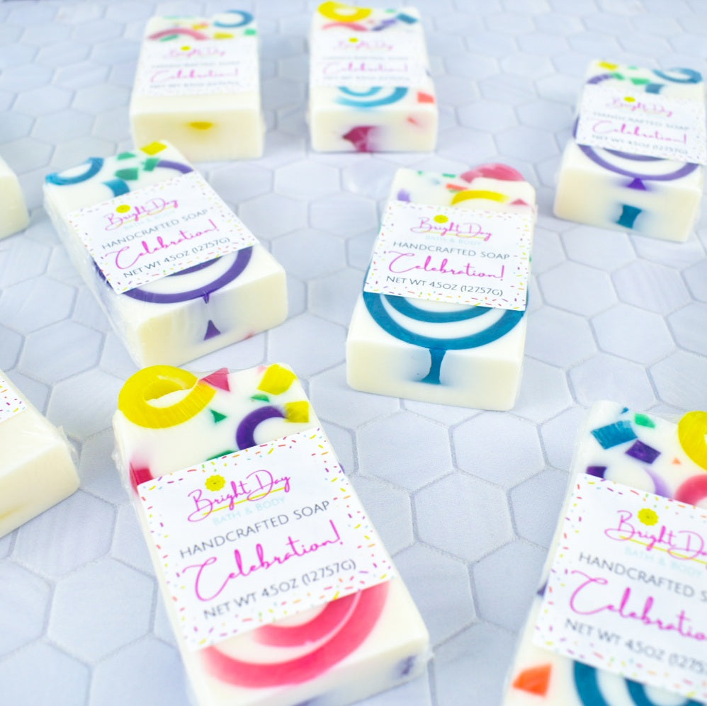 White bars of soap with multicolored curls and chunks embedded in them.