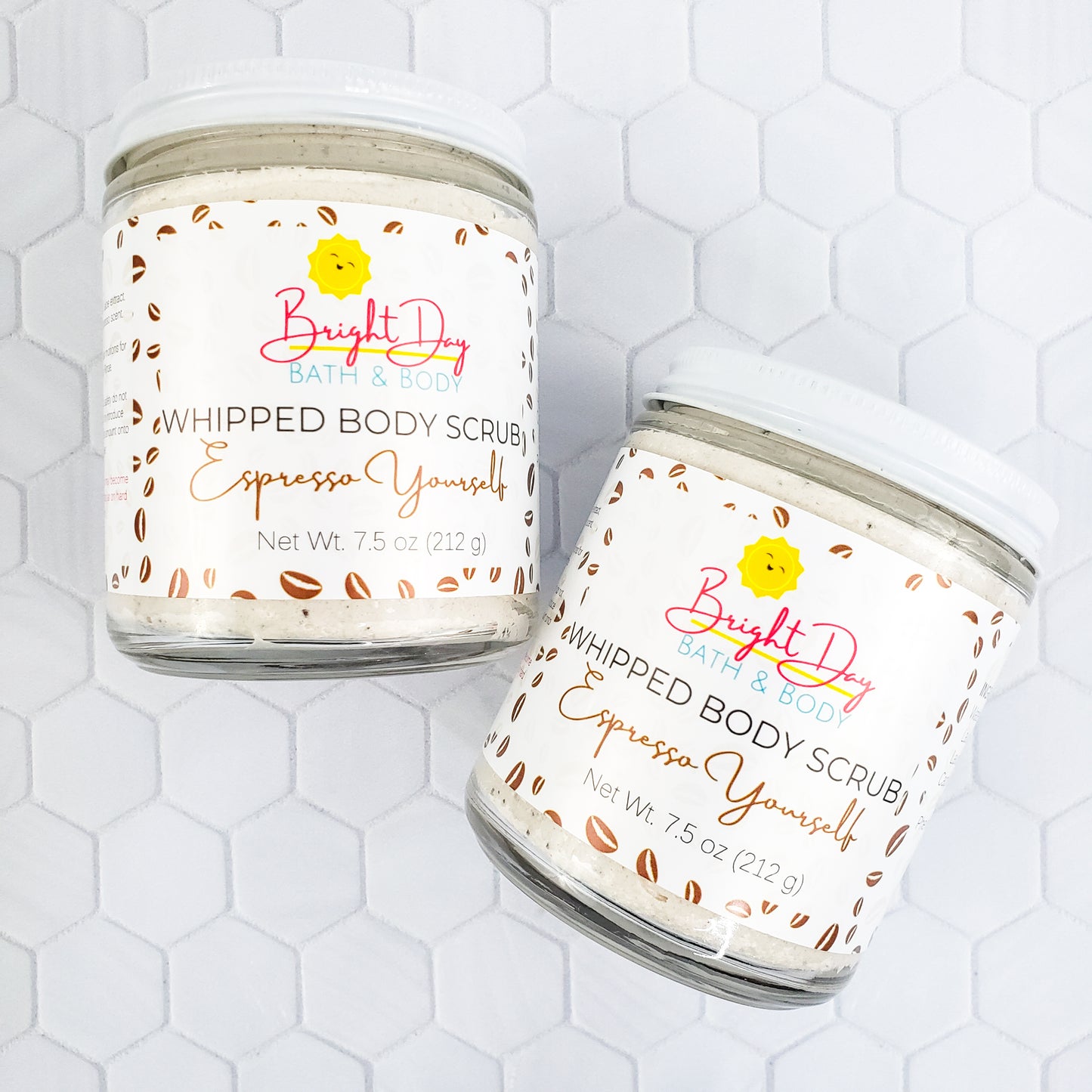 Two Espresso Yourself Body Scrubs on a tile background