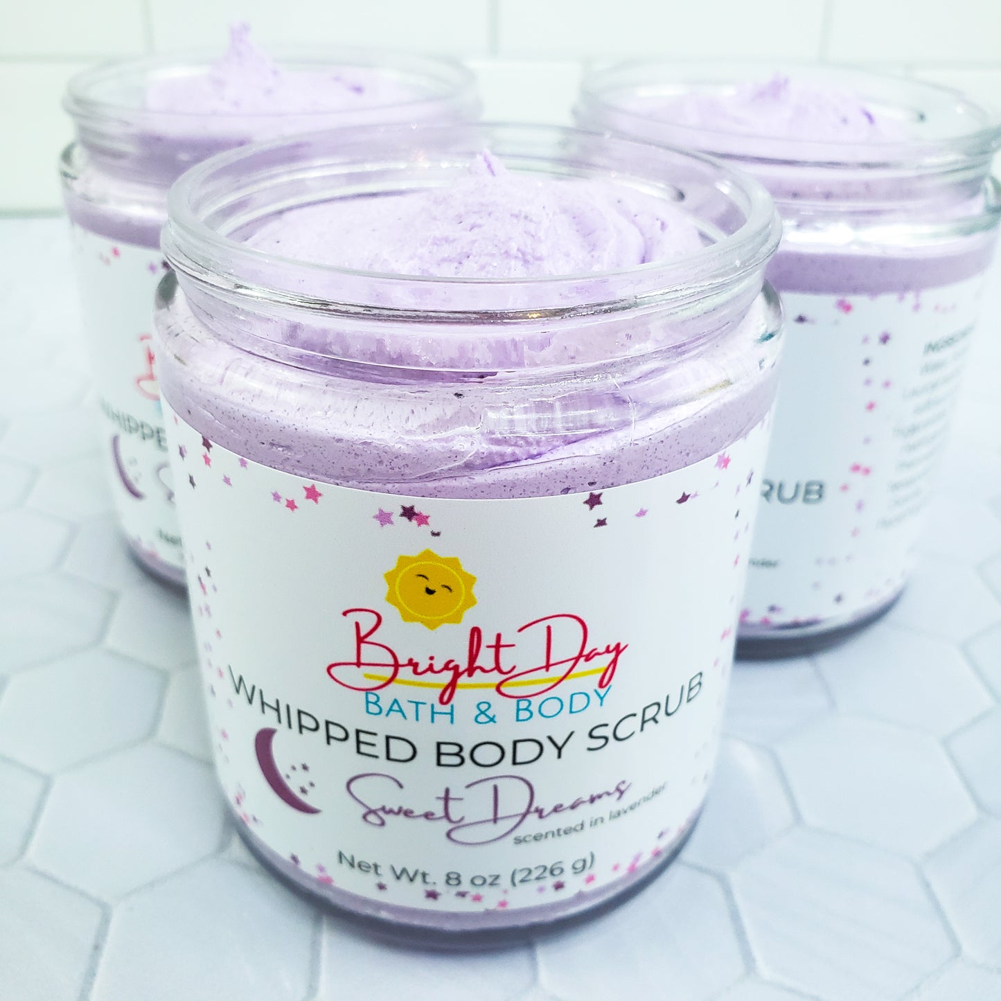 Sweet Dreams Body Scrubs on a tile background