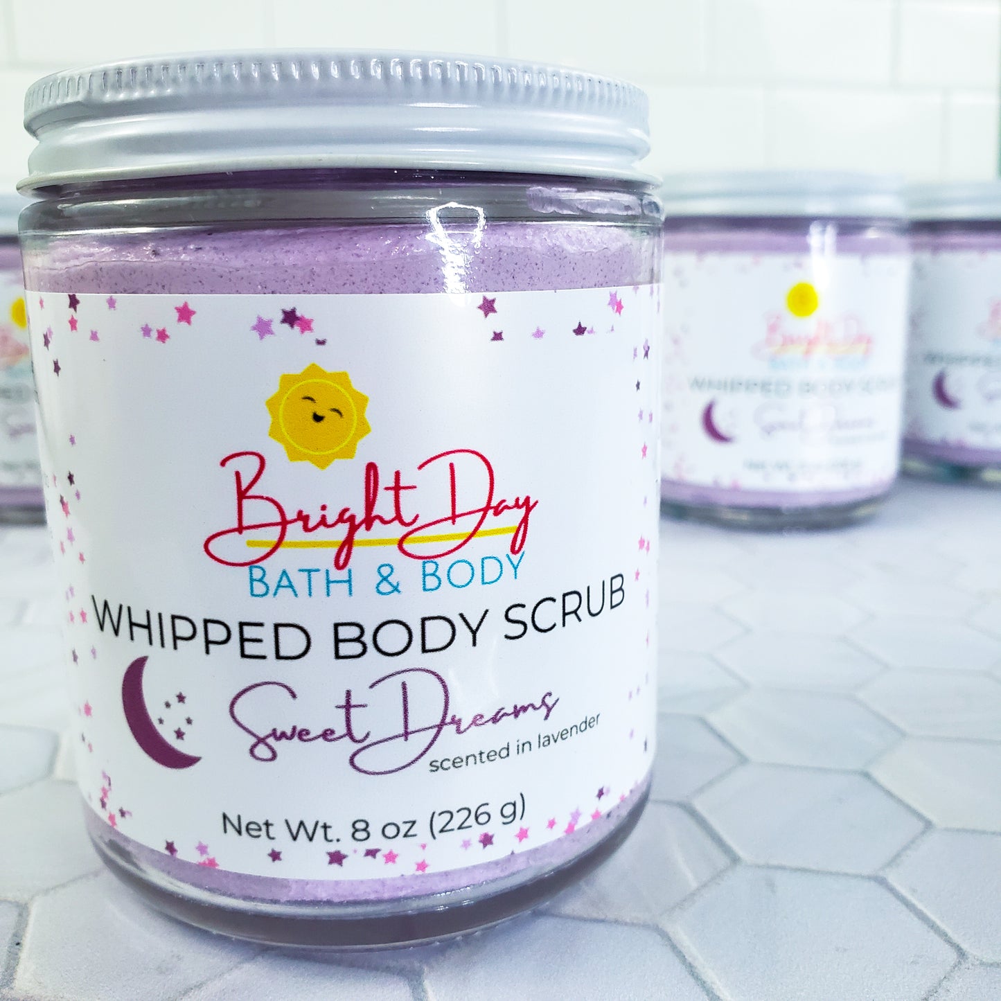 Sweet Dreams Body Scrubs on a tile background