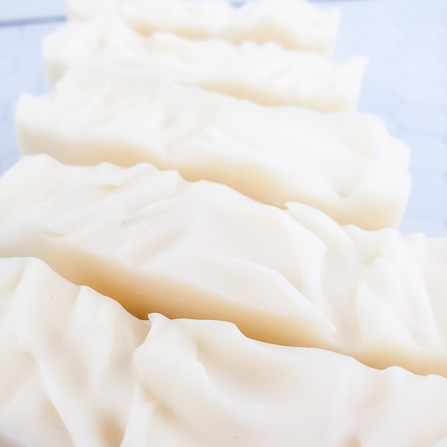 a photo of the textured tops of white soap bars