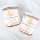 Two Citrus Bliss Body Scrubs on a tile background