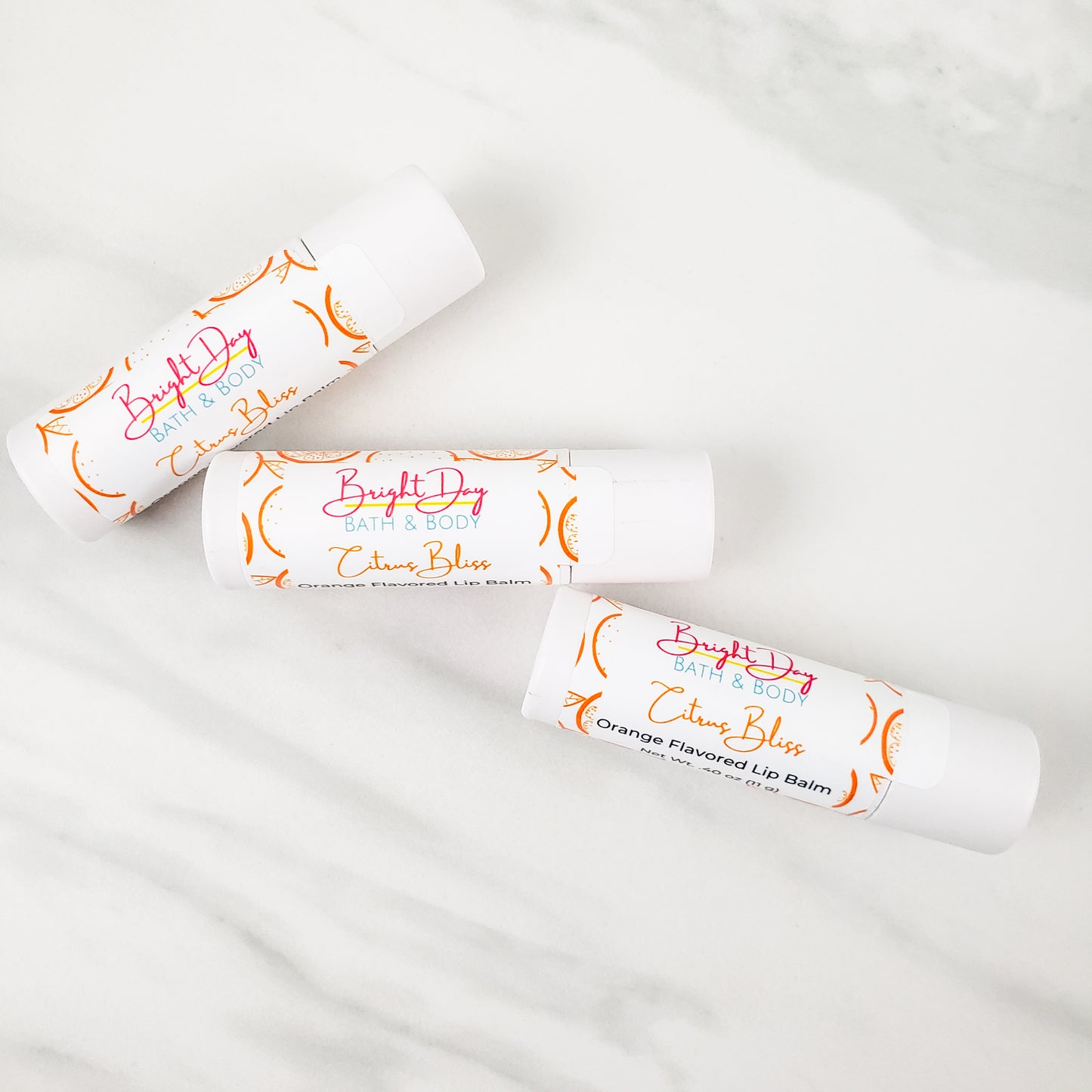 three Citrus Bliss lip balms