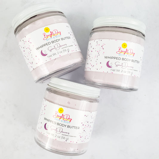Three Sweet Dreams Body Butter Jars on a tile background