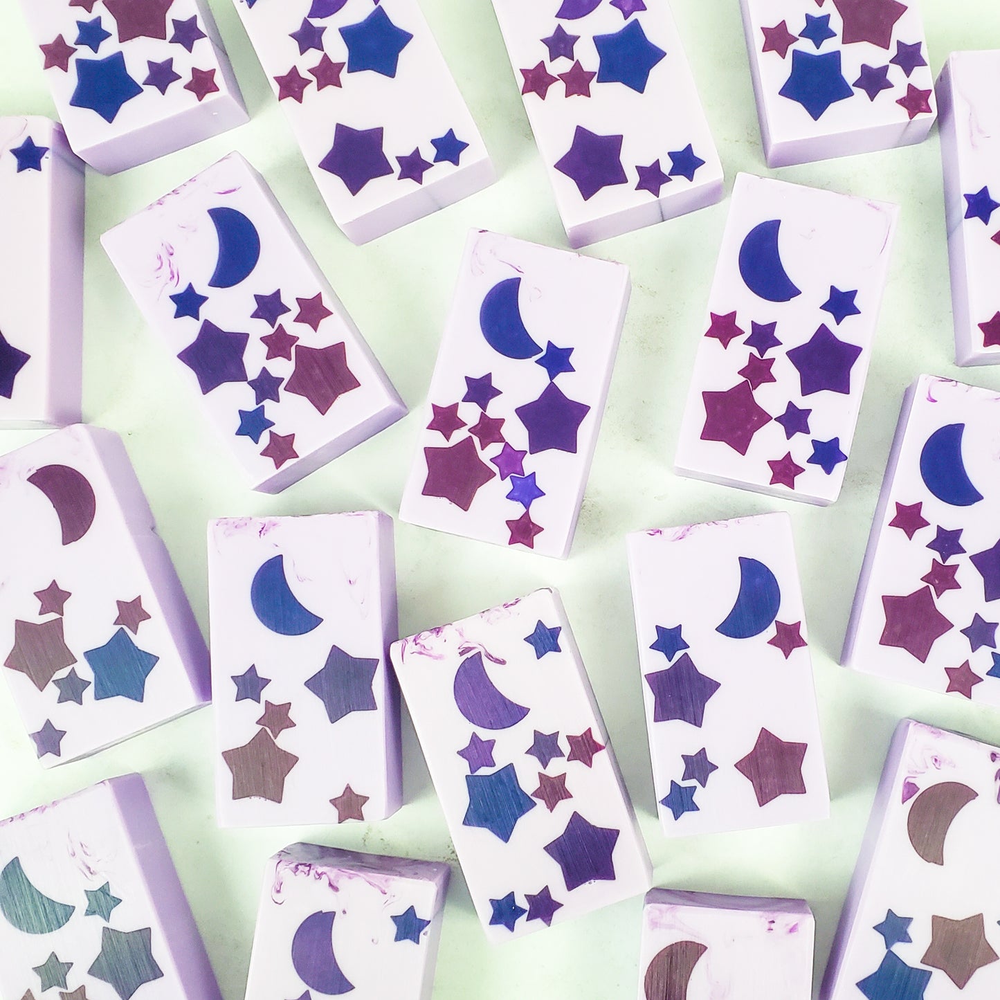 Several purple rectangle soaps with purple stars and moon in the centers