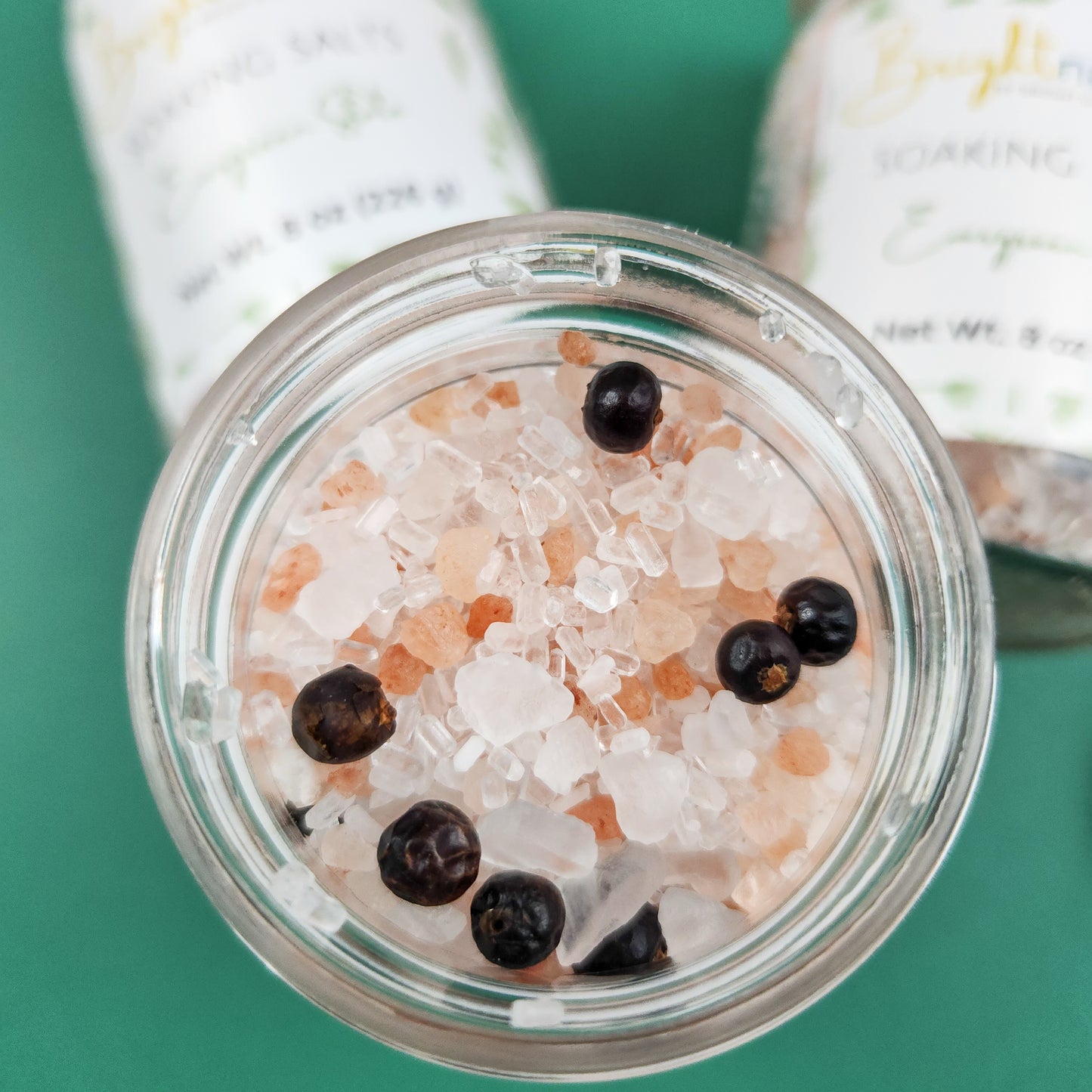 A closeup of the soaking salt blends in a jar of Evergreen State Soaking Salts